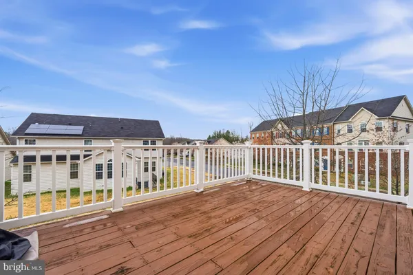 a view of a balcony with wooden floor
