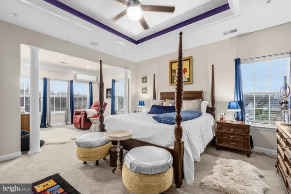 a living room with furniture a rug and a chandelier