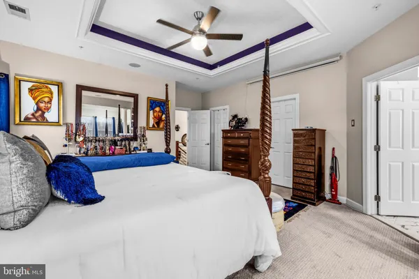 a bed room with a bed and a walk in closet