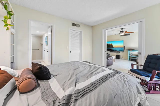 a bedroom with a bed and dresser