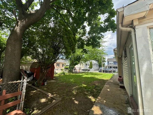 a view of a park with large trees