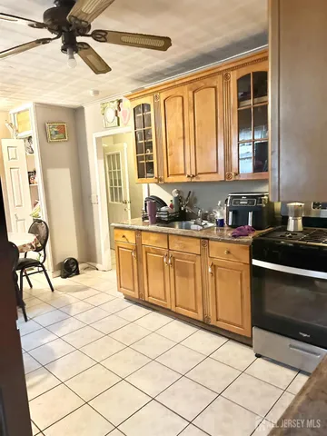 a kitchen with a sink cabinets and window