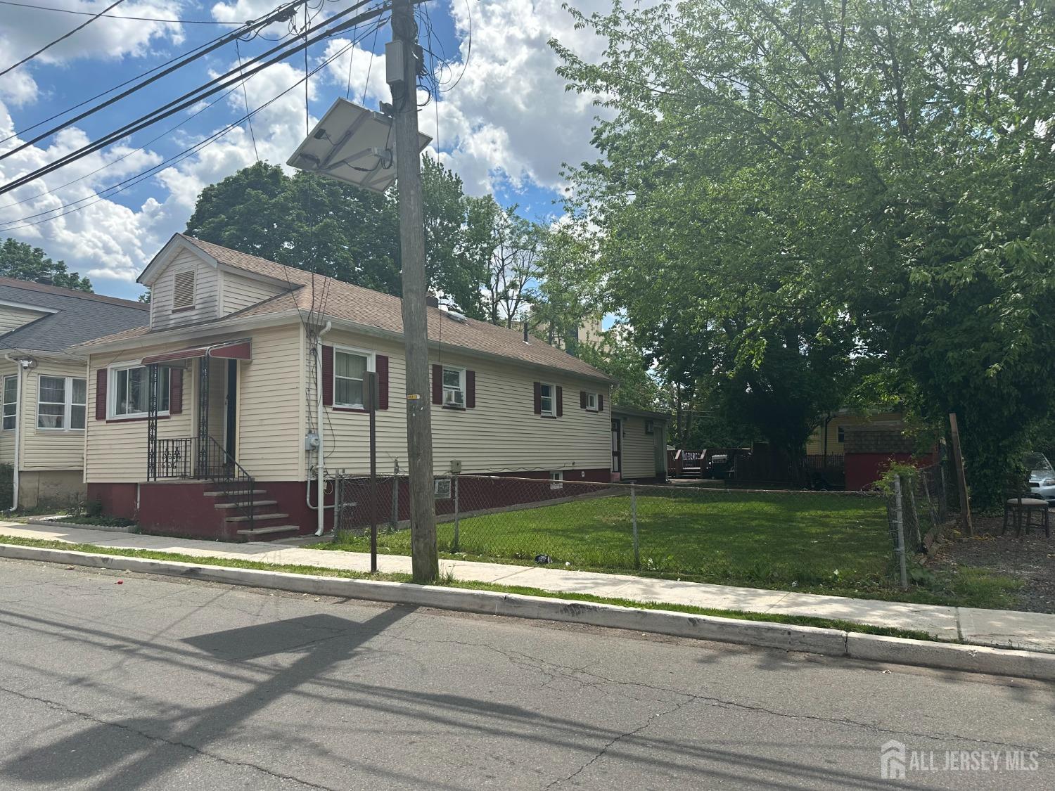 44 South Ward Street New Brunswick, NJ 08901 - Photo 3 of 34 a front view of a house with a yard and garage