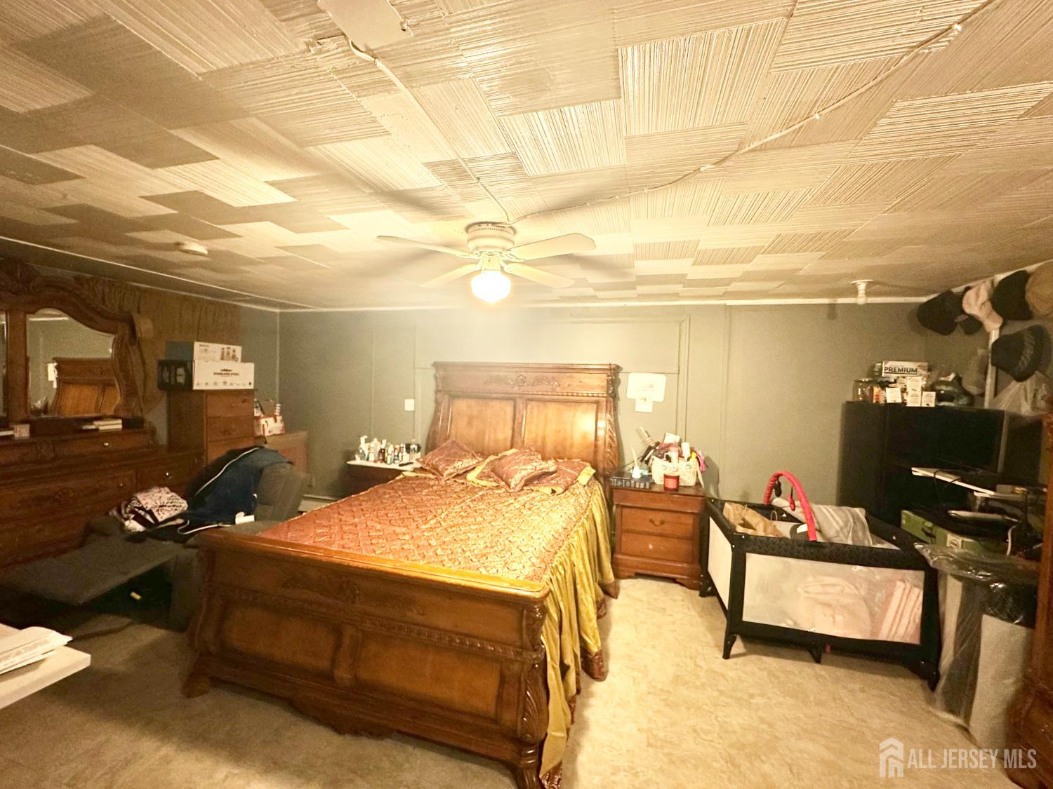 44 South Ward Street New Brunswick, NJ 08901 - Photo 32 of 34 a bedroom with a bed and wooden floor