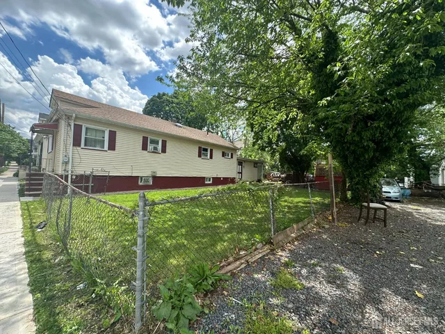 a view of backyard with green space