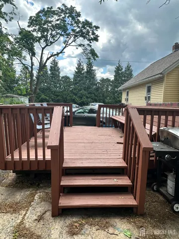 a view of a wooden deck with furniture