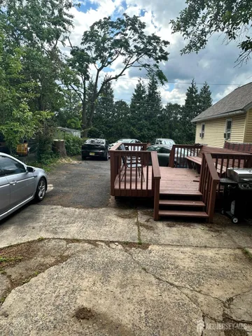 a view of a couches and a fire pit in the back yard