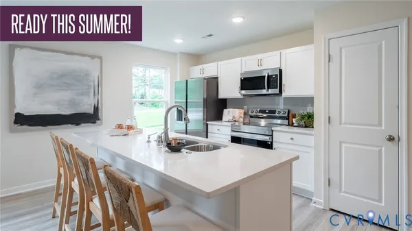 a kitchen with a table and chairs
