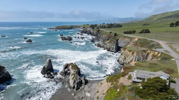 a view of a road with an ocean view