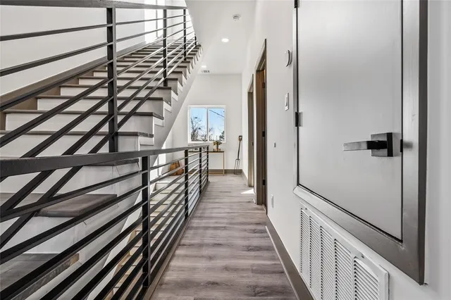 a bathroom with a toilet sink a mirror and shower