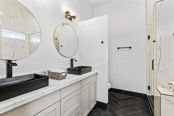 a close view of a sink and a cabinet in a kitchen