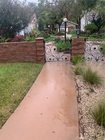 a view of a backyard with sitting area