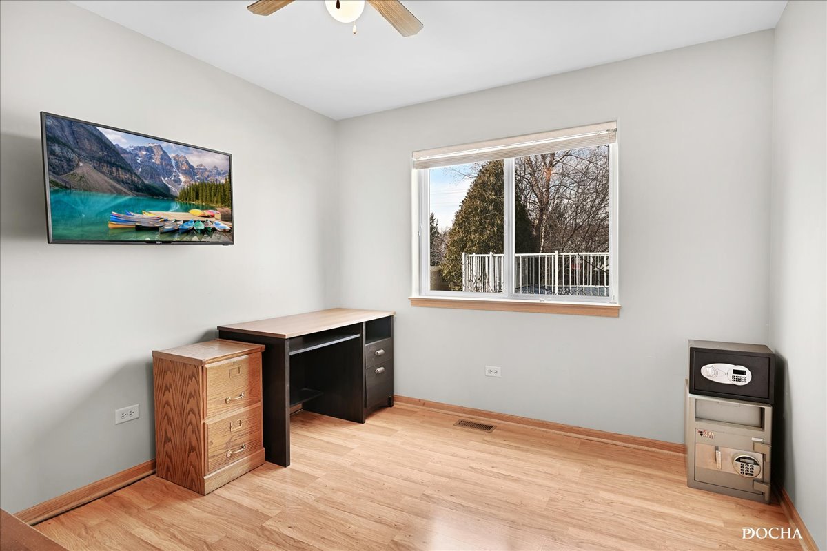 2209 Gray Hawk Drive Plainfield, IL 60586 - Photo 13 of 51 a view of workspace with wooden floor and window