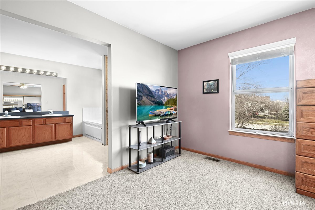 2209 Gray Hawk Drive Plainfield, IL 60586 - Photo 17 of 51 a living room with furniture and a flat screen tv