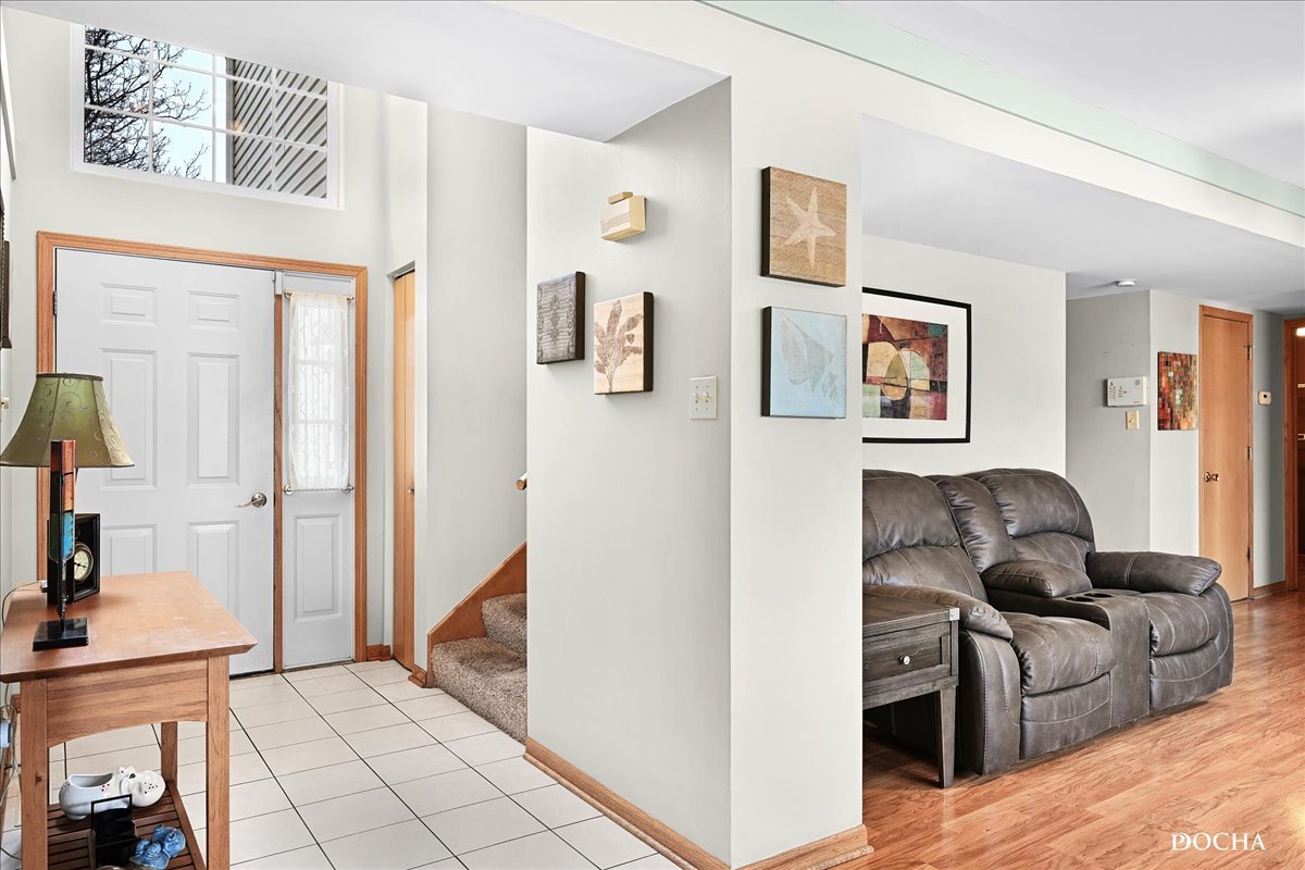 2209 Gray Hawk Drive Plainfield, IL 60586 - Photo 2 of 51 a living room with furniture and a refrigerator