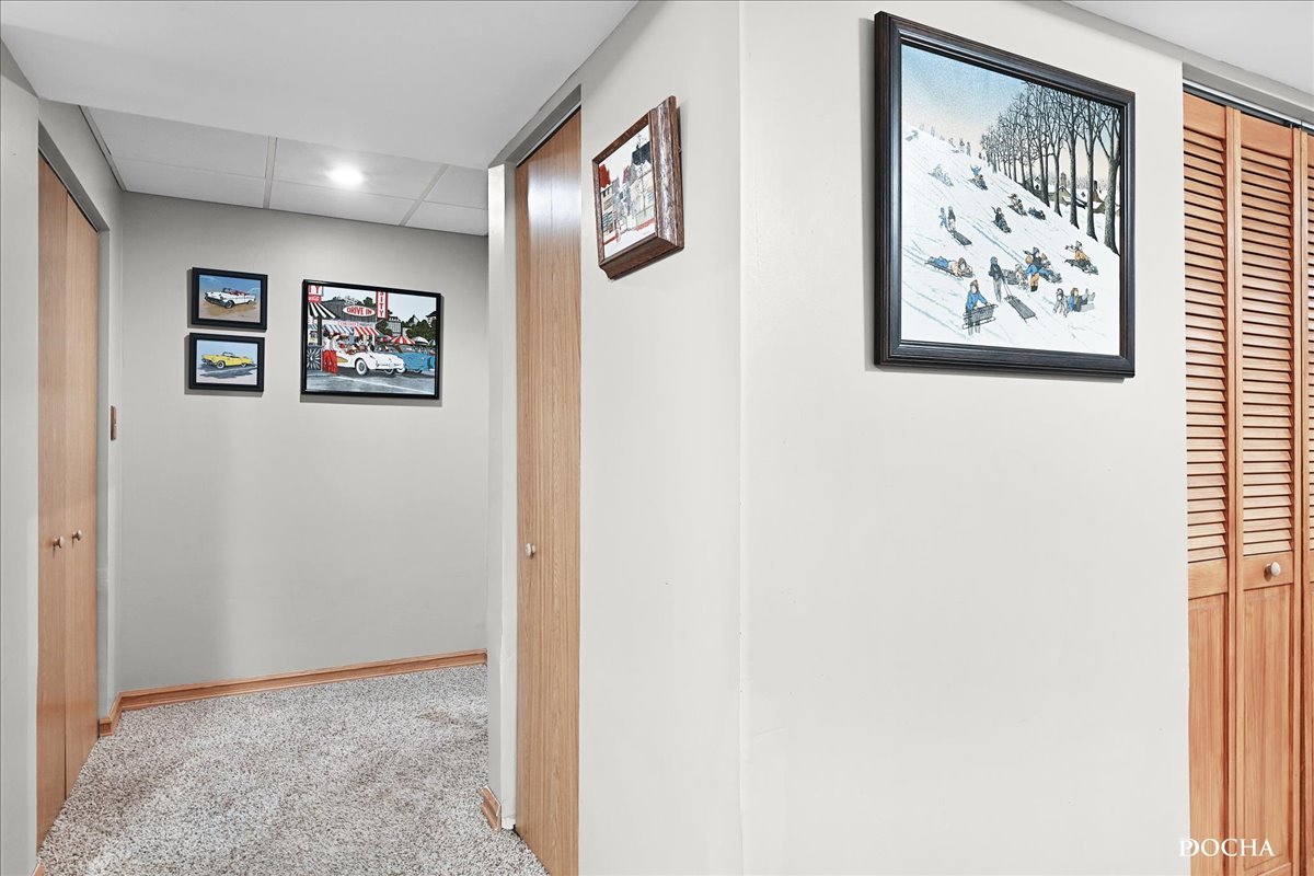 2209 Gray Hawk Drive Plainfield, IL 60586 - Photo 24 of 51 a view of a hallway with a bookshelf