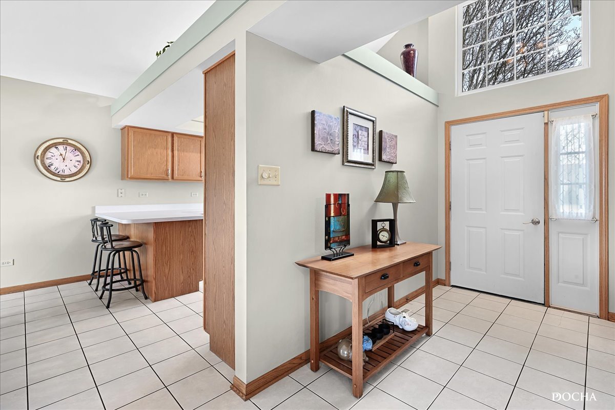 2209 Gray Hawk Drive Plainfield, IL 60586 - Photo 3 of 51 a view of a room with shelves and wooden floor