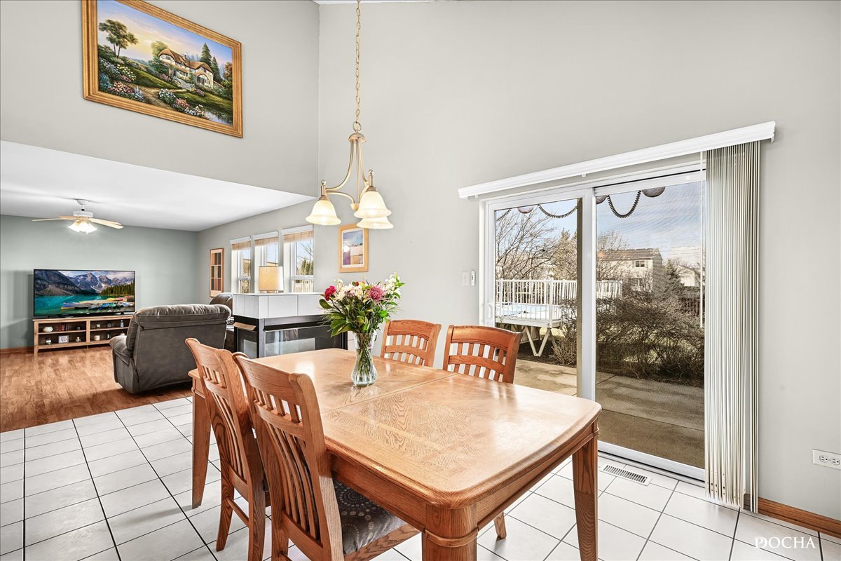 2209 Gray Hawk Drive Plainfield, IL 60586 - Photo 9 of 51 a view of a dining room with furniture window and outside view