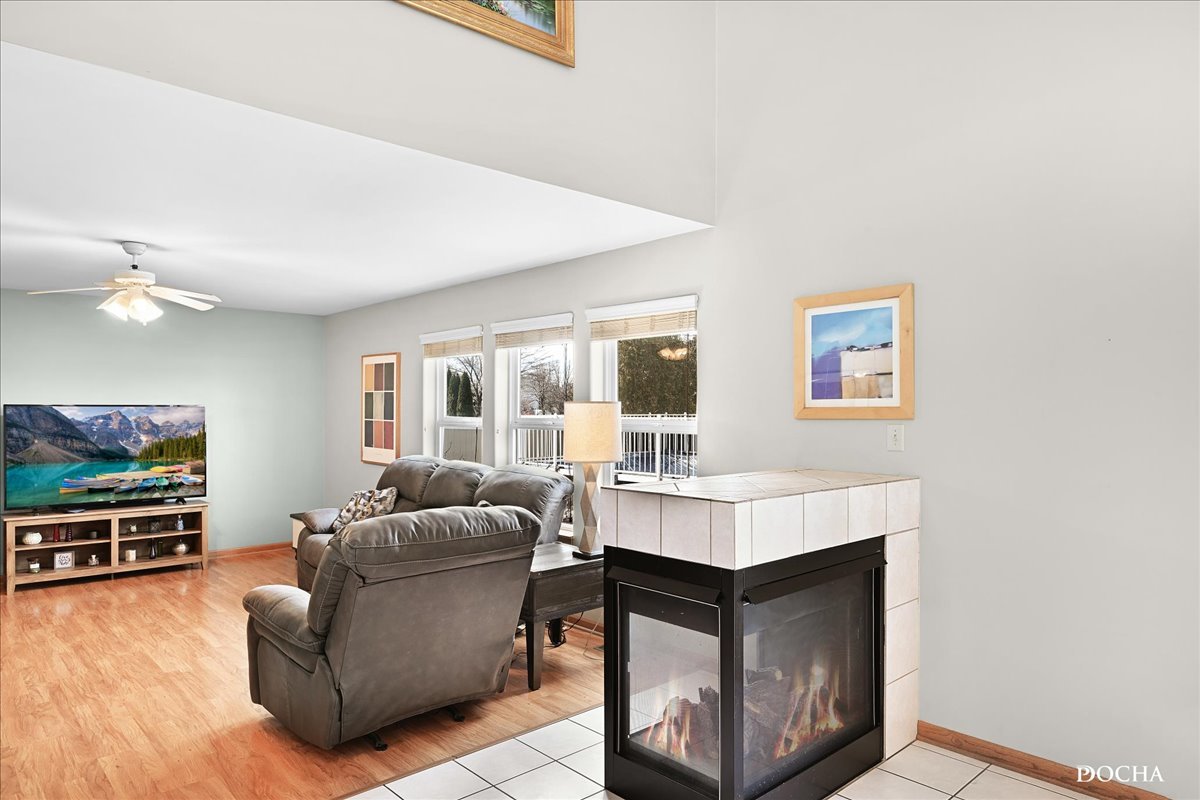 2209 Gray Hawk Drive Plainfield, IL 60586 - Photo 10 of 51 a living room with furniture and a flat screen tv