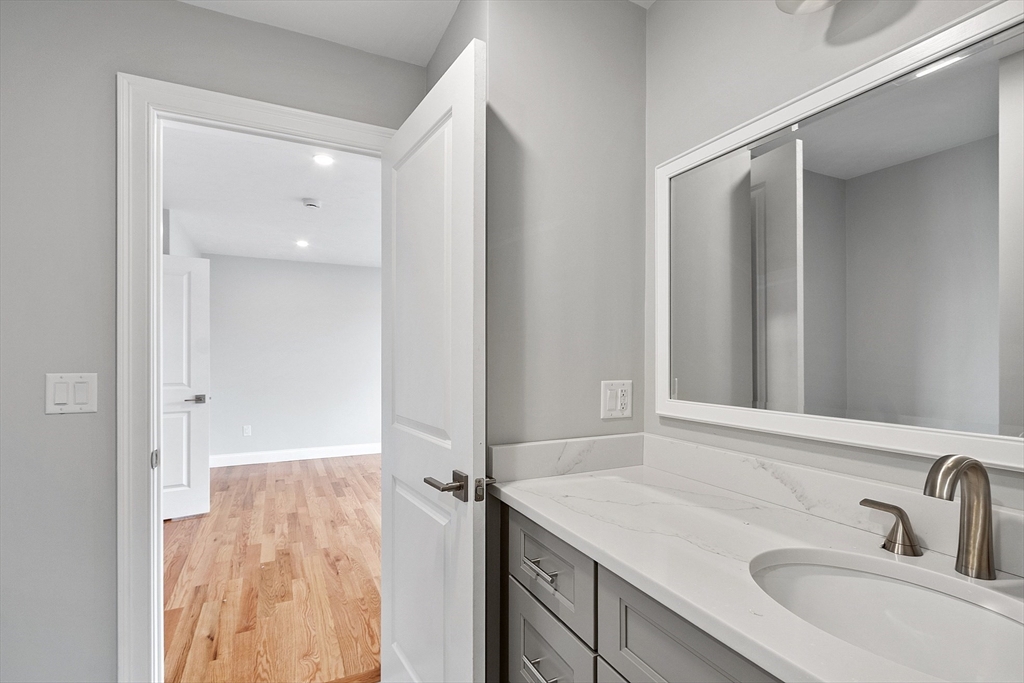 10 Windsor Street, Unit C Worcester, MA 01605 - Photo 15 of 31 a bathroom with a sink and a mirror