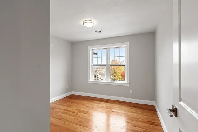 a view of an empty room and window