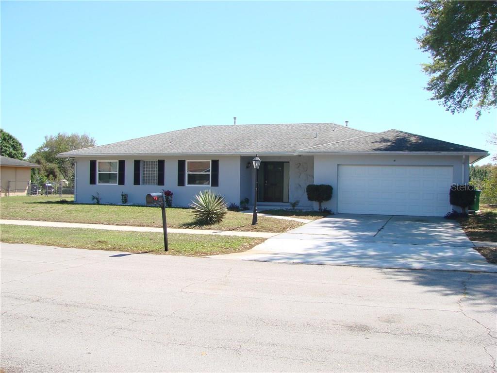 2517 Delaware Road Deltona, FL 32738 - Photo 1 of 1 a front view of a house with a yard