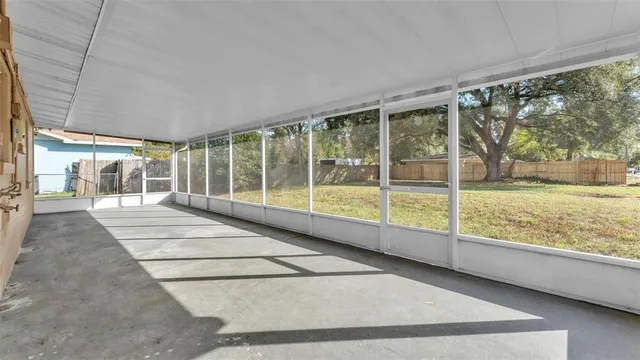 a view of an empty room with a large window