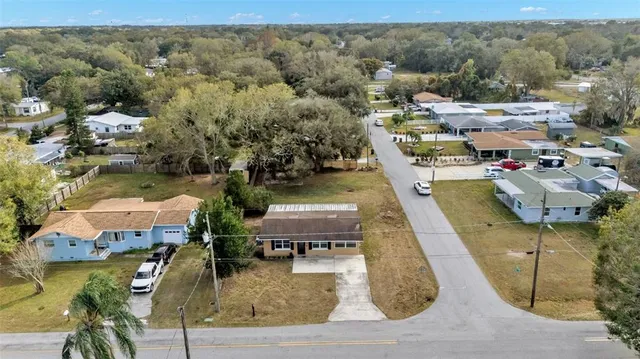 an aerial view of a house with a swimming pool