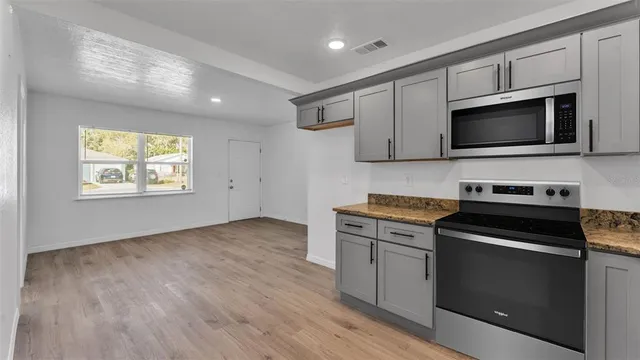 a kitchen with a stove and a microwave