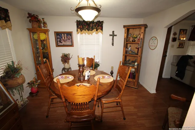 a view of a dining room with furniture and wooden floor