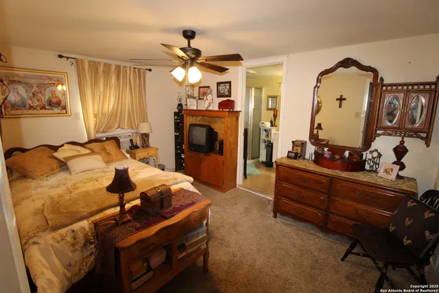 a bed room with a bed and a chandelier