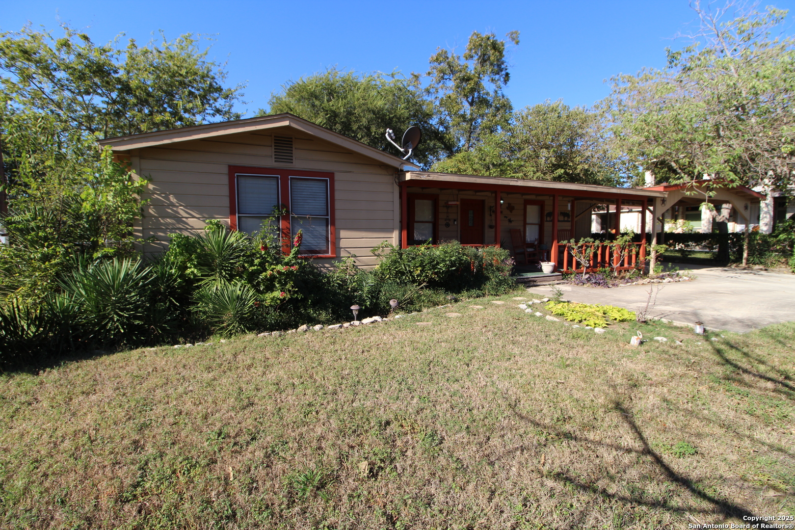 19411 South Somerset Street Lytle, TX 78052 - Photo 10 of 27 a backyard of a house with yard and outdoor seating