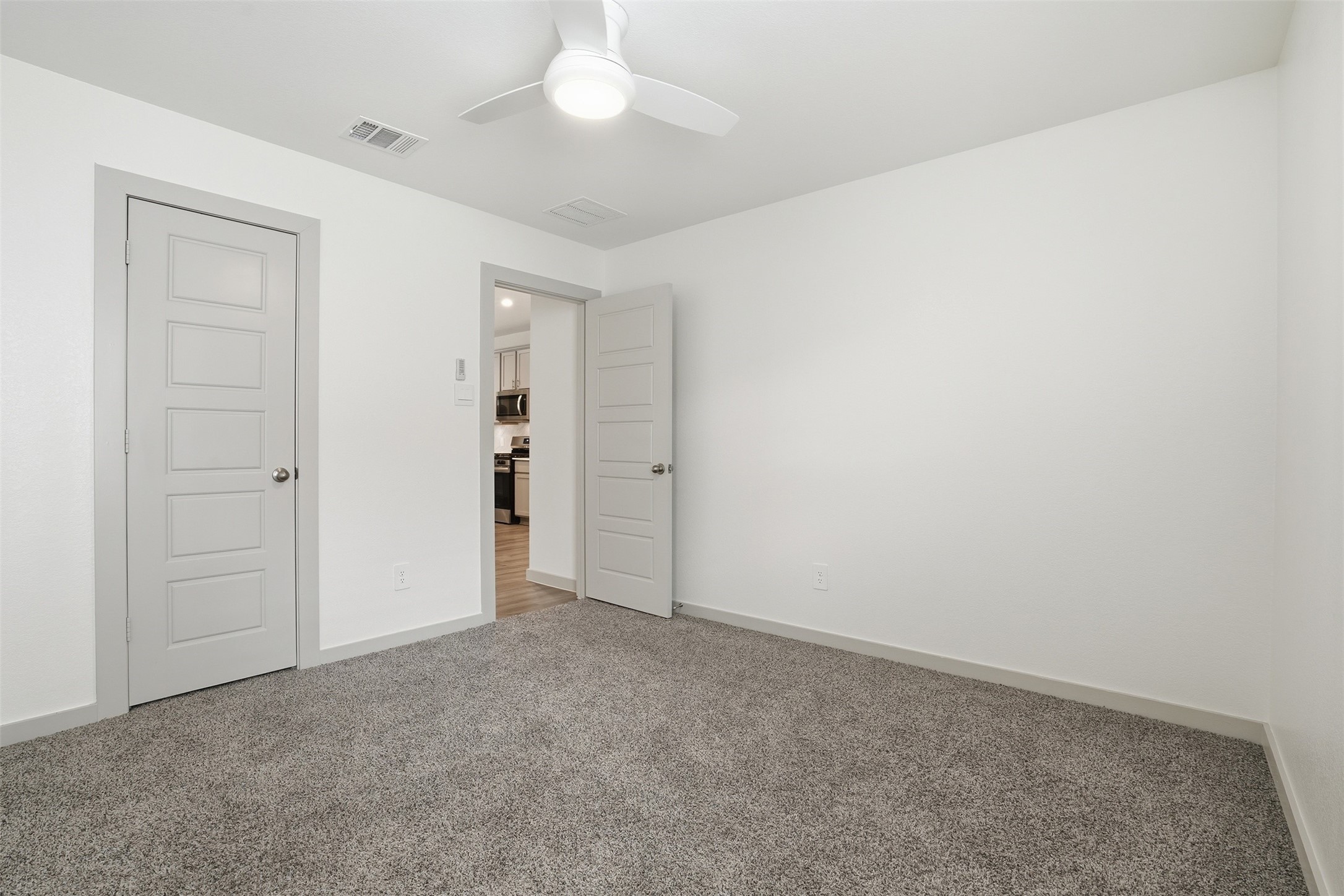 1022 Curly Angora Court Rosharon, TX 77583 - Photo 12 of 17 an empty room with a ceiling fan and closet area