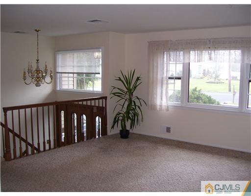 29 Morganville Road Old Bridge, NJ 07747 - Photo 2 of 9 a view of hallway with livingroom and furniture