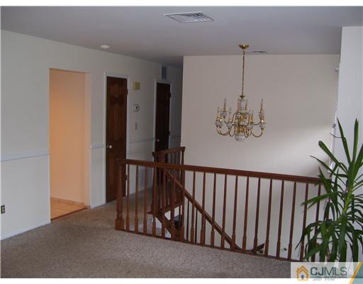 29 Morganville Road Old Bridge, NJ 07747 - Photo 3 of 9 a view of a hallway with a window