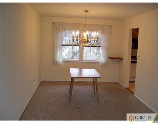29 Morganville Road Old Bridge, NJ 07747 - Photo 4 of 9 a view of a livingroom with furniture window and wooden floor