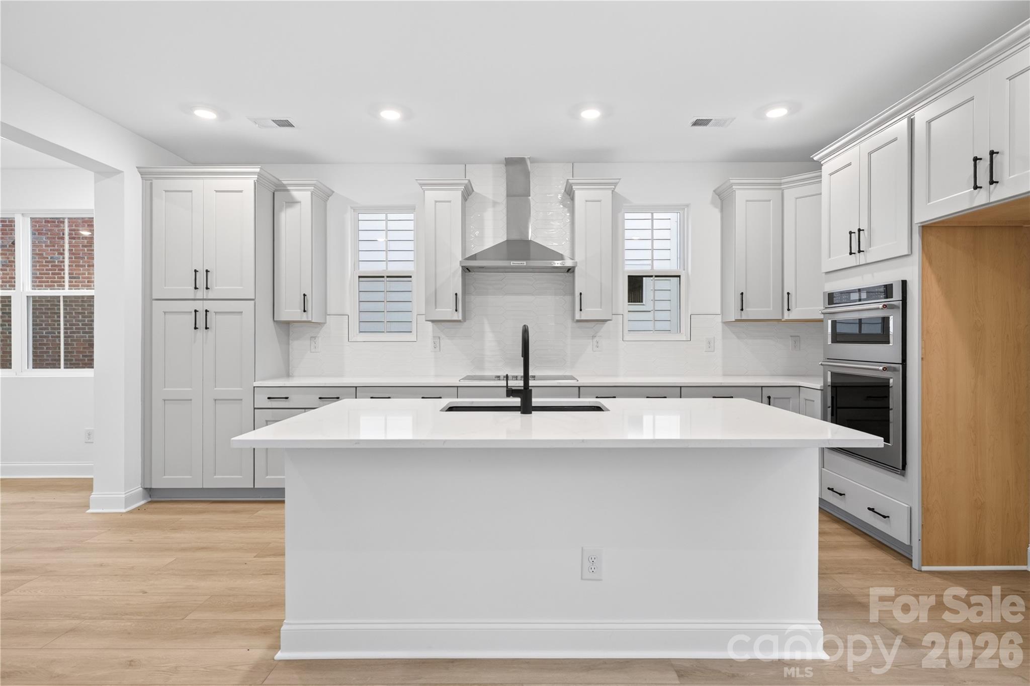 416 Celestial Drive Tega Cay, SC 29708 - Photo 5 of 21 a kitchen with kitchen island sink stove and refrigerator