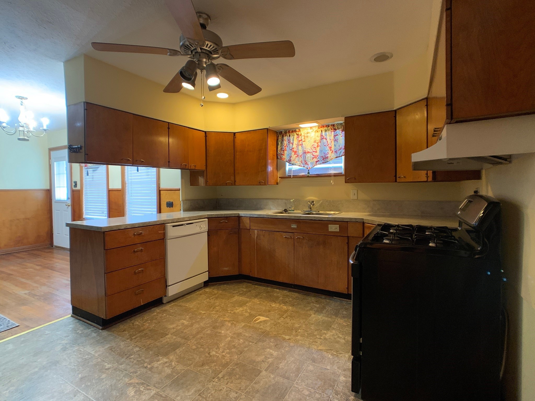 519 West Commerce Street Buffalo, TX 75831 - Photo 16 of 28 a kitchen with a stove a sink and a refrigerator