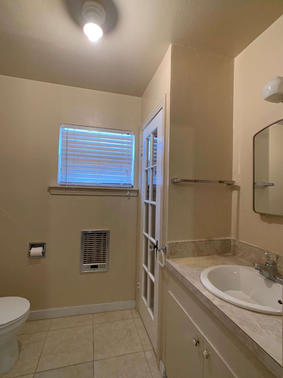 519 West Commerce Street Buffalo, TX 75831 - Photo 24 of 28 a bathroom with a granite countertop sink toilet and shower
