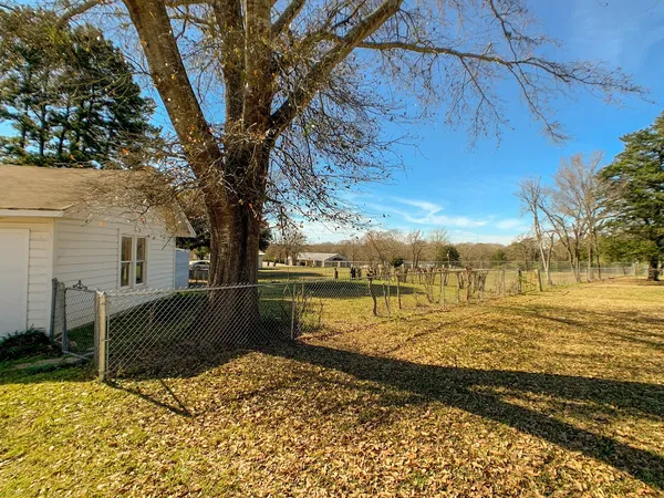 a view of a house with a big yard