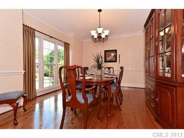 550 Cranborne Chase Fort Mill, SC 29708 - Photo 4 of 16 a view of a dining room with furniture a chandelier and wooden floor