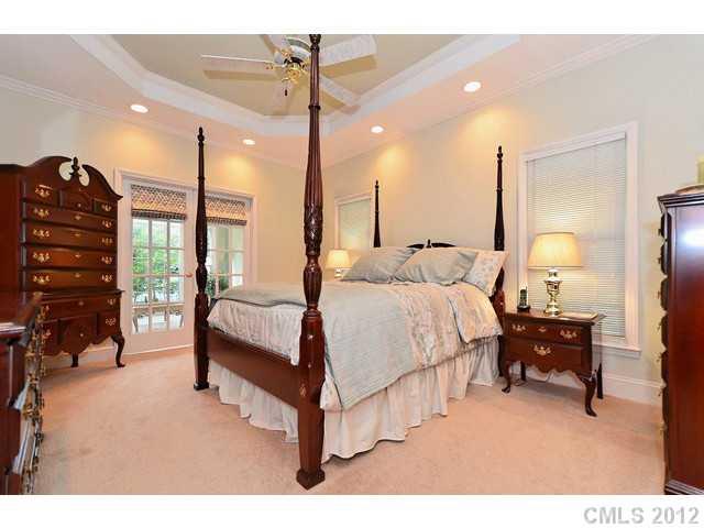 550 Cranborne Chase Fort Mill, SC 29708 - Photo 6 of 16 a spacious bedroom with a bed a table and chairs