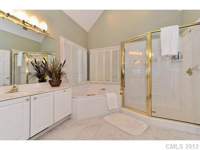 550 Cranborne Chase Fort Mill, SC 29708 - Photo 7 of 16 a bathroom with a double vanity sink a mirror and a shower