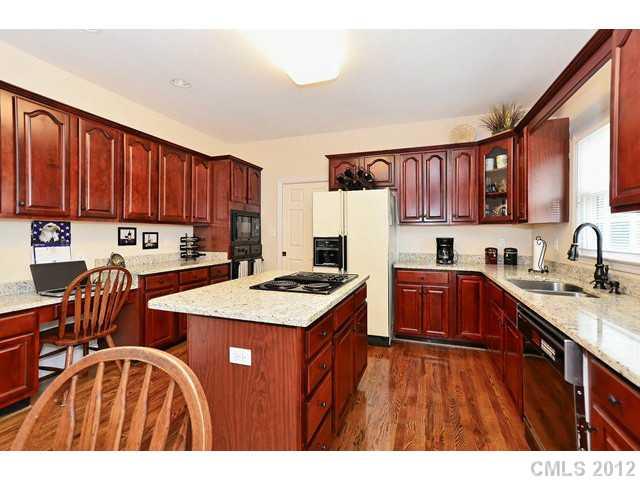 550 Cranborne Chase Fort Mill, SC 29708 - Photo 10 of 16 a kitchen with stainless steel appliances sink stove refrigerator and cabinets