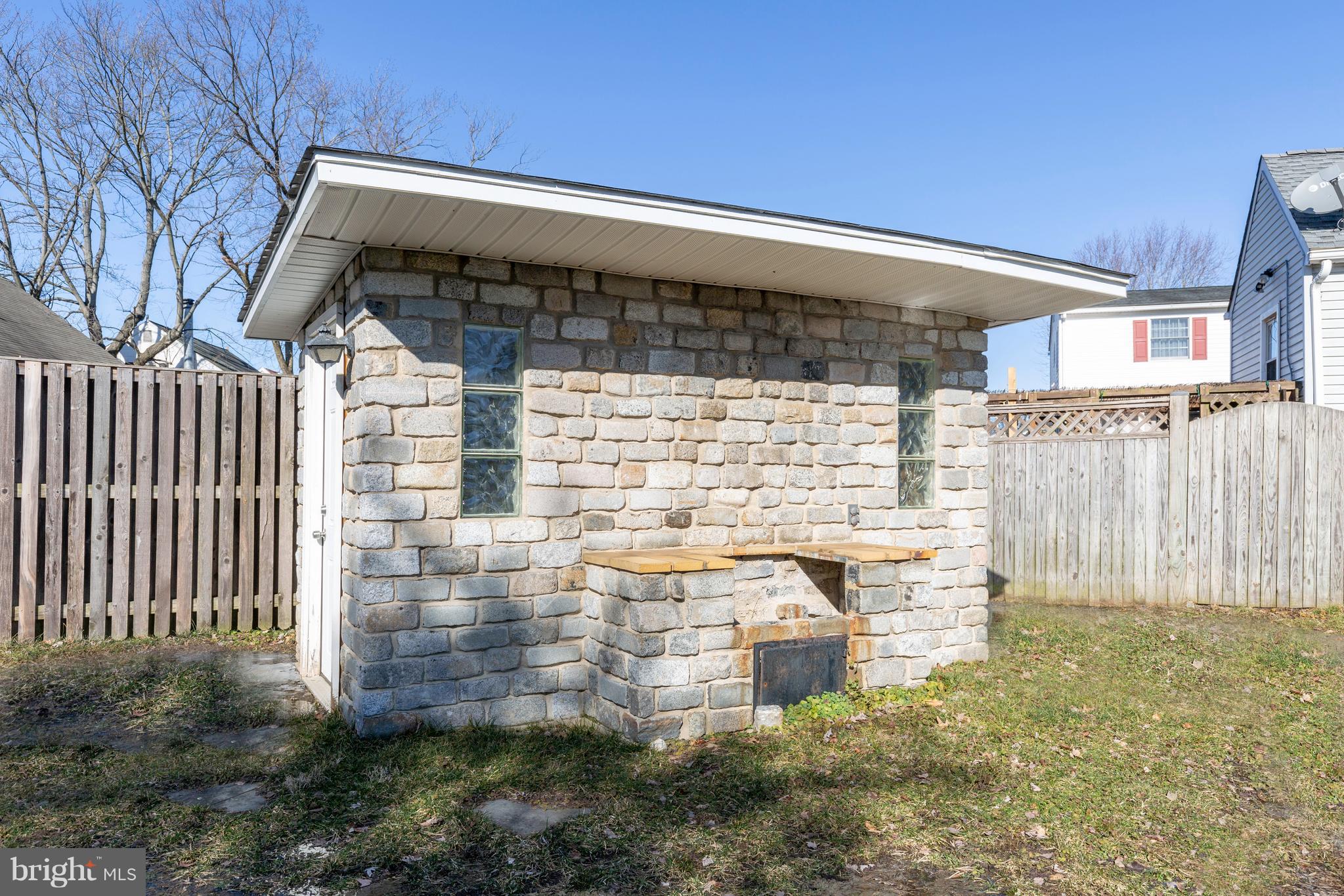 1 Twin Oaks Road Linthicum, MD 21090 - Photo 25 of 84 Pretty stone shed and BBQ.