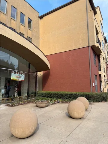 a view of a building with sitting area