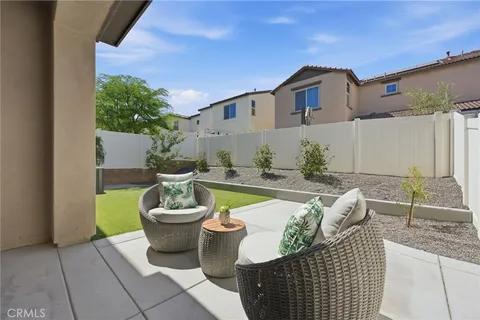 a view of house with backyard