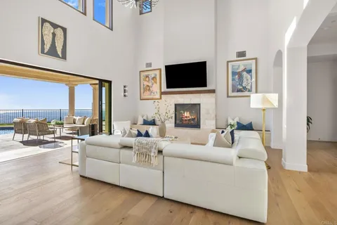 a living room with furniture fireplace and a flat screen tv