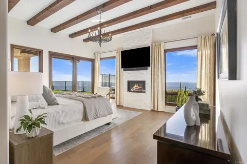 a living room with furniture fireplace and flat screen tv