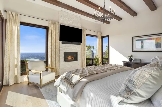 a bedroom with a bed and a fireplace